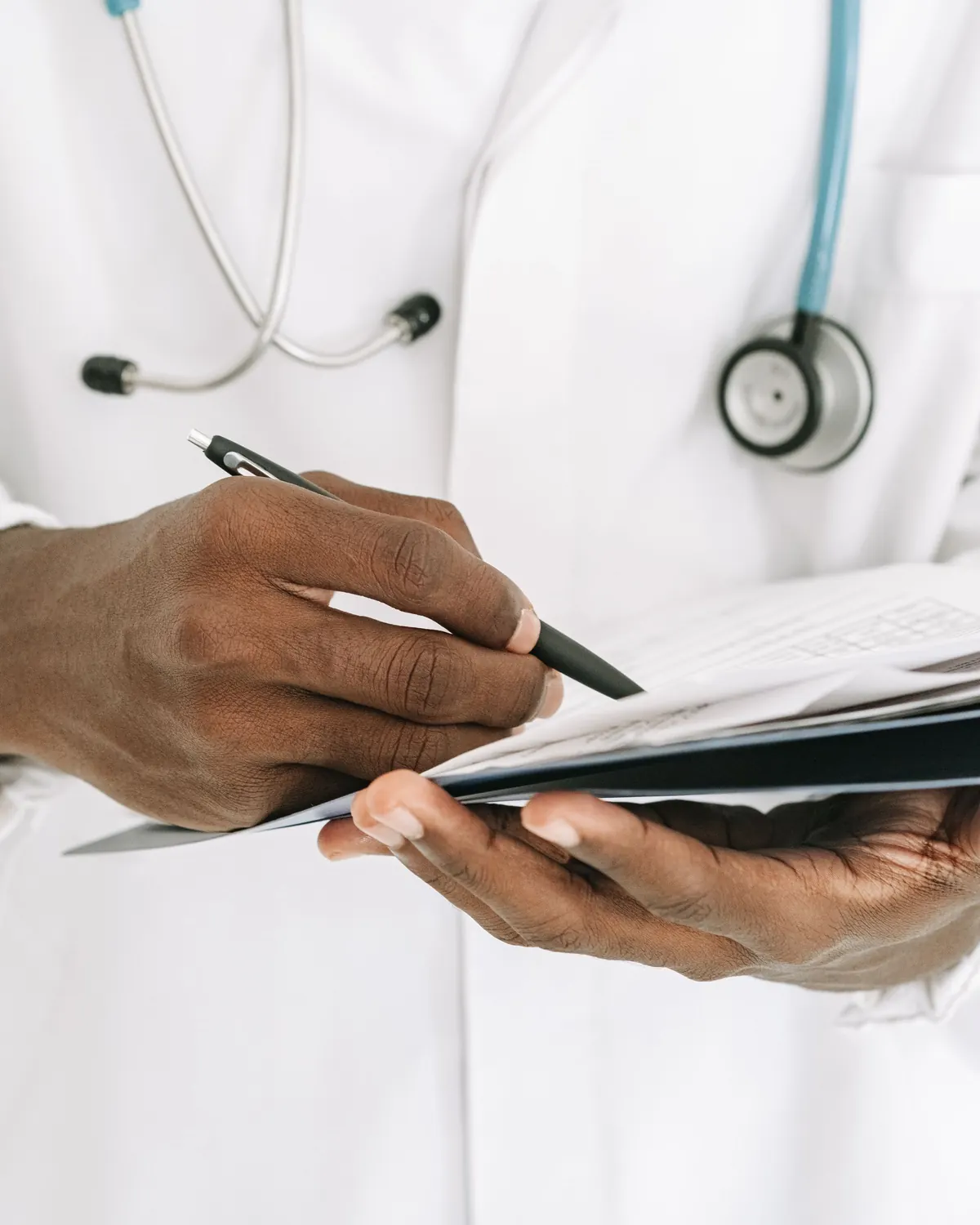Healthcare professional writing up care notes