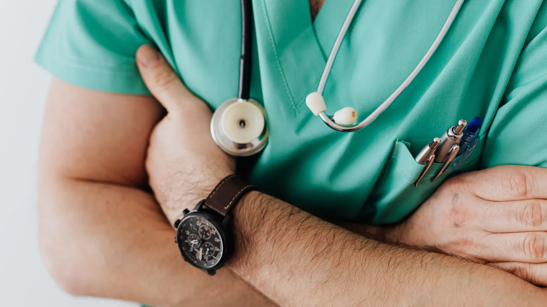Nurse in green scrubs with a stethoscope